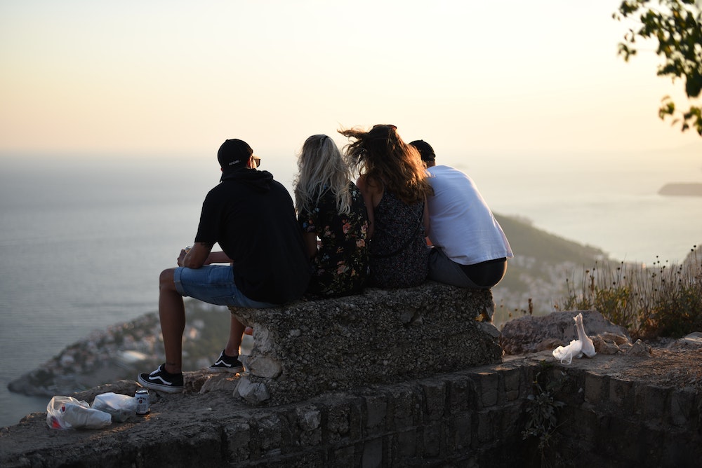 4 friends enjoying the sunset